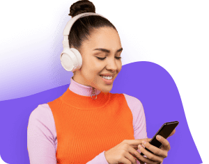 A woman wearing headset while listening music and holding a cellphone