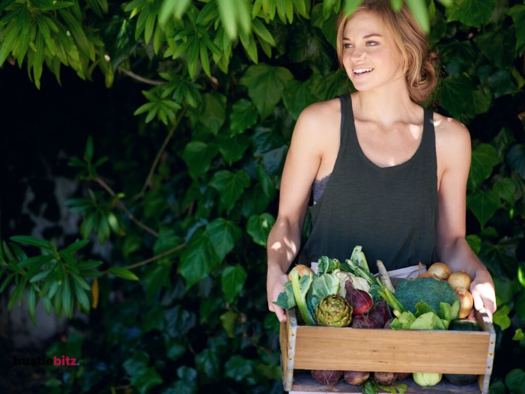 woman holding a different types of vegetables