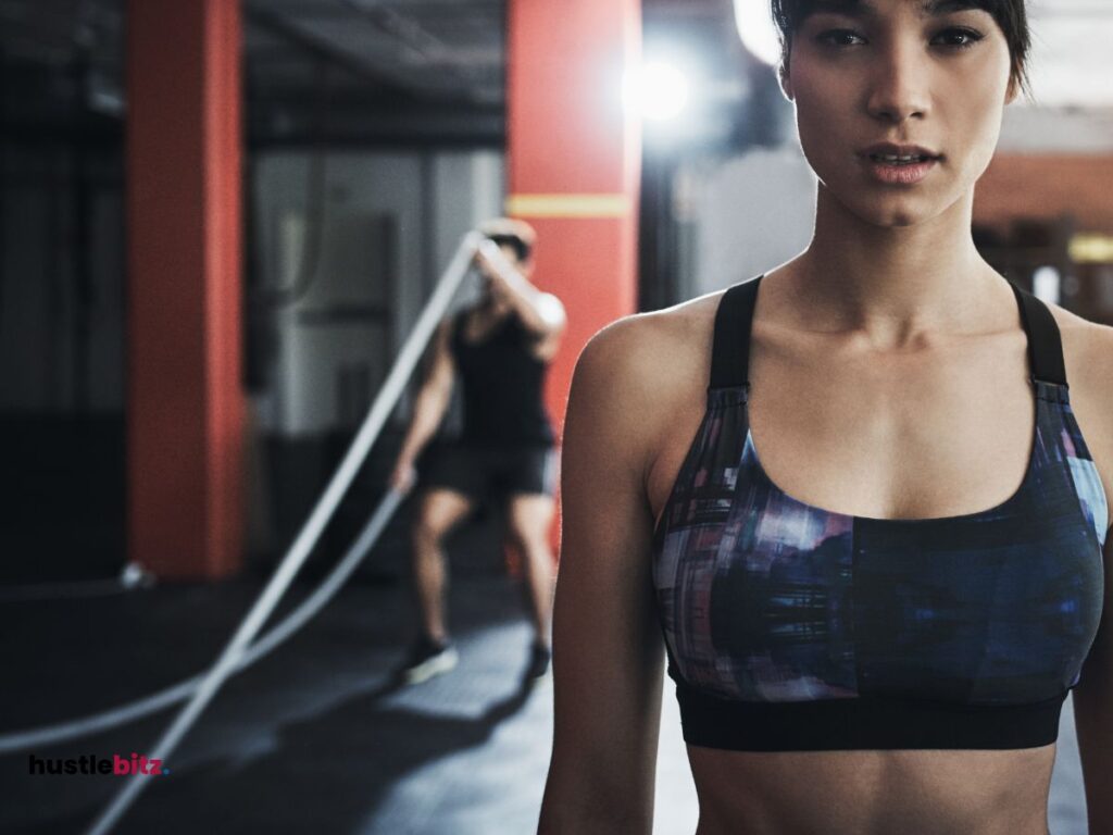 A woman standing in front of camera preparing for exercise