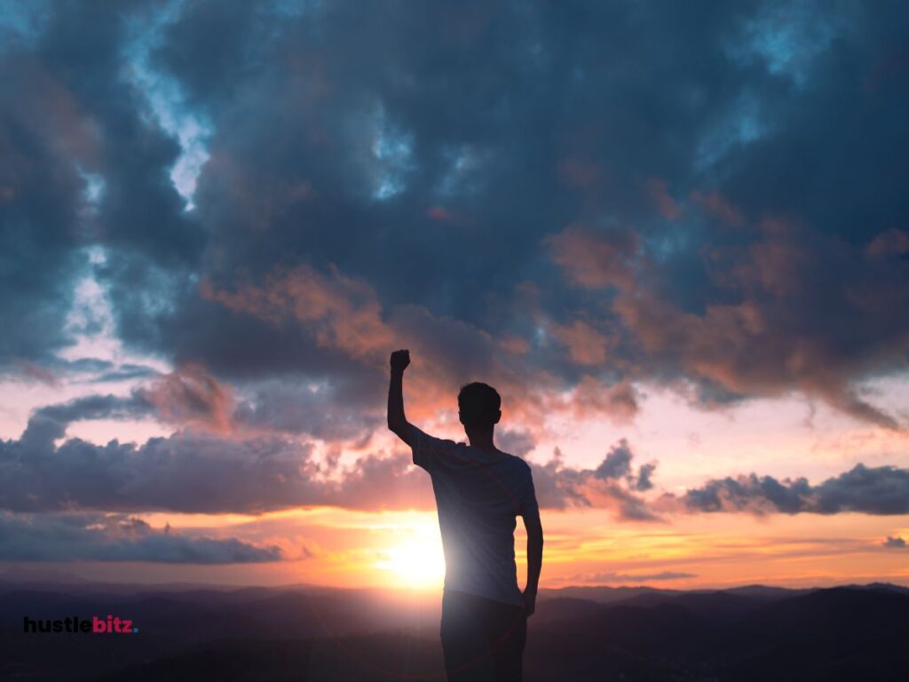 A man standing in front of the nature up his left hand