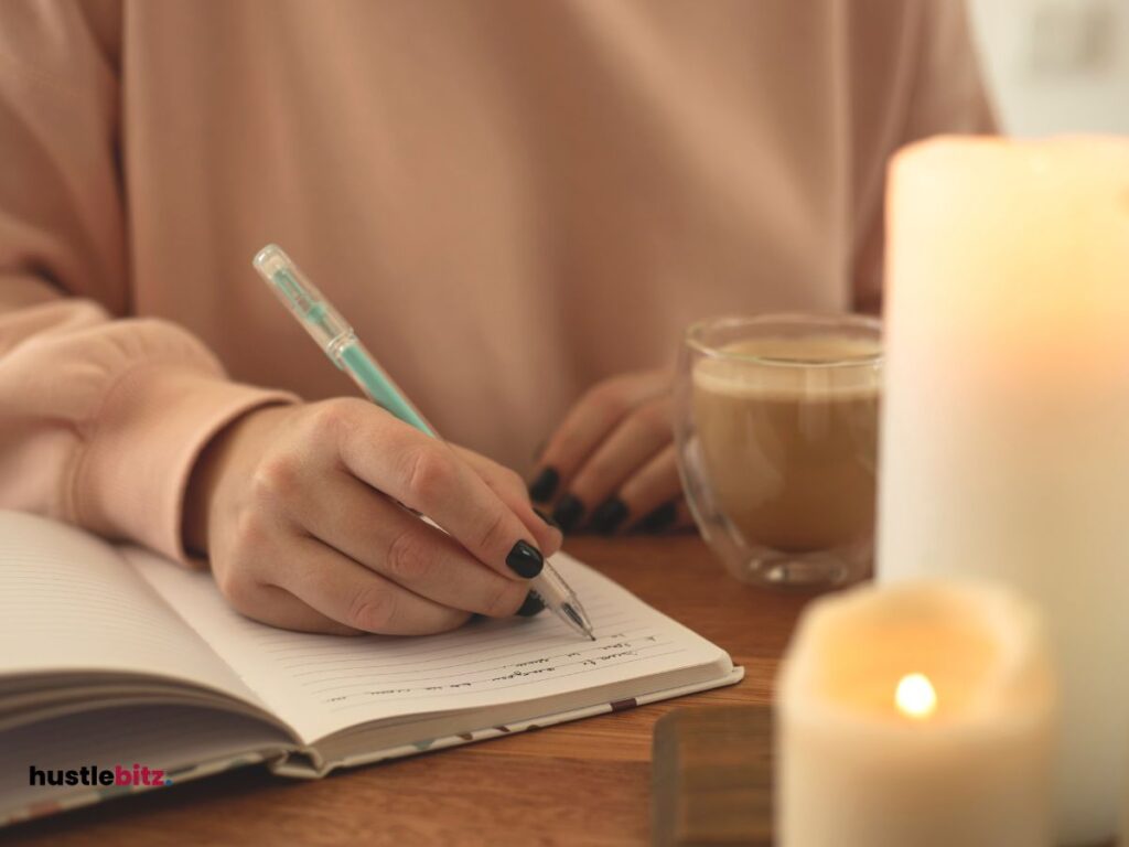 A woman writing and a coffee in the table