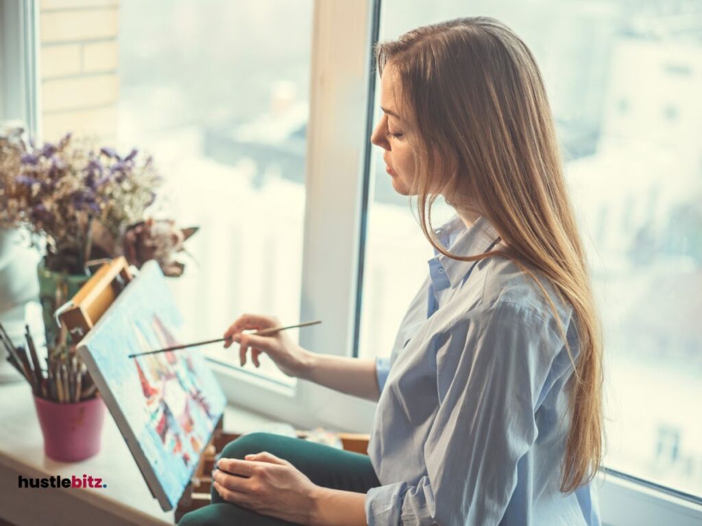 A woman doing painting beside the window