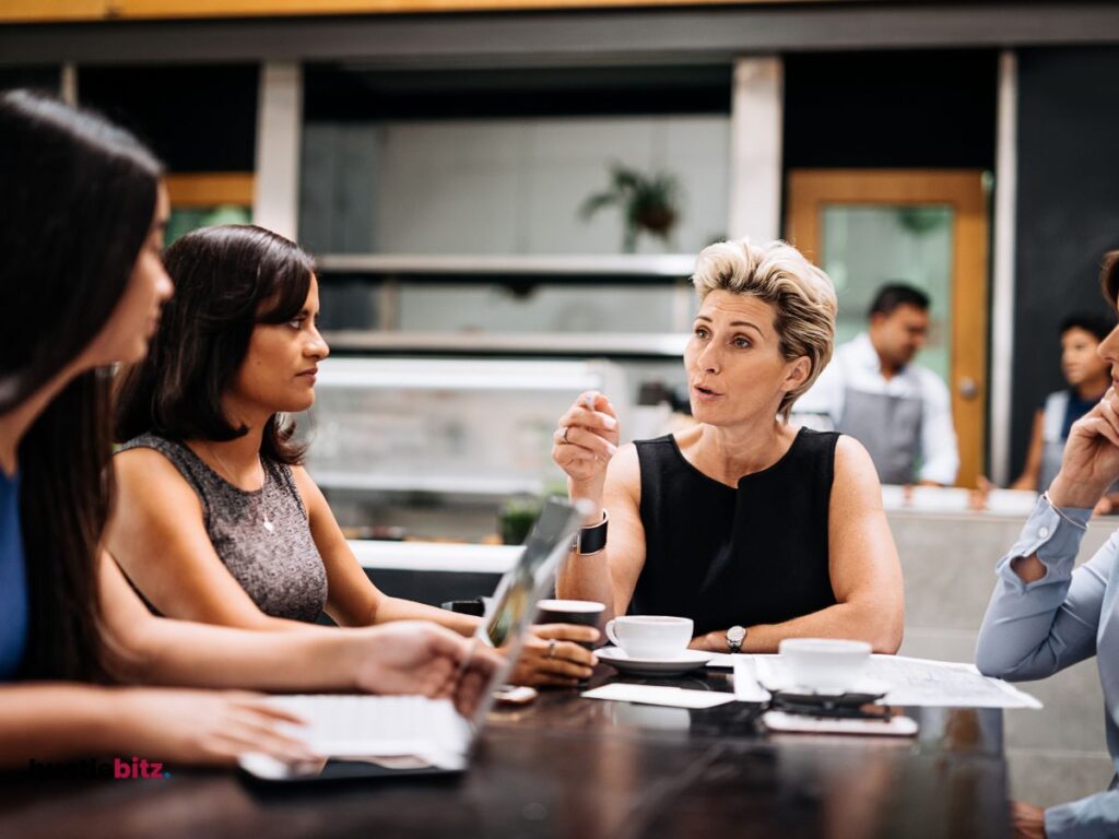 group of people chatting about business inside the office