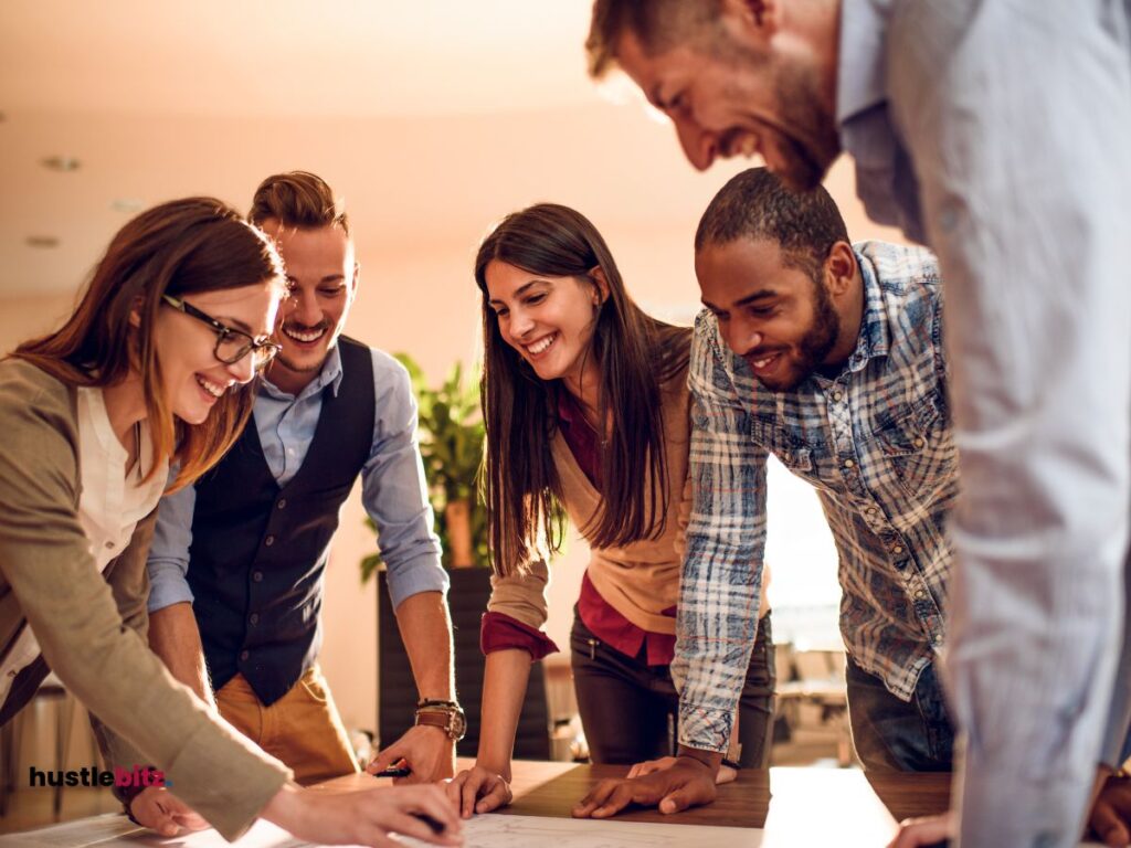 A picture of people planning and talking inside the office