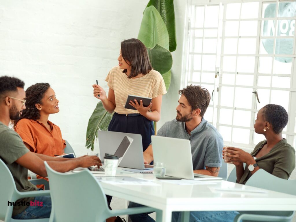 group of people talking and sit the chair beside the table