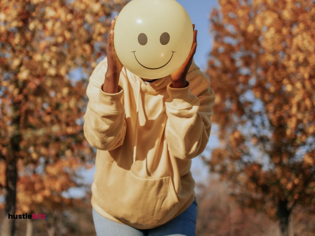 A picture of a woman holding a balloon with happy emotions