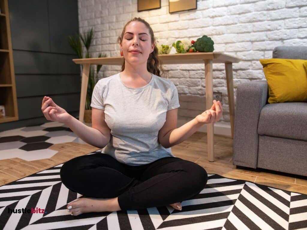 A woman doing meditation and a vegetables in the tables