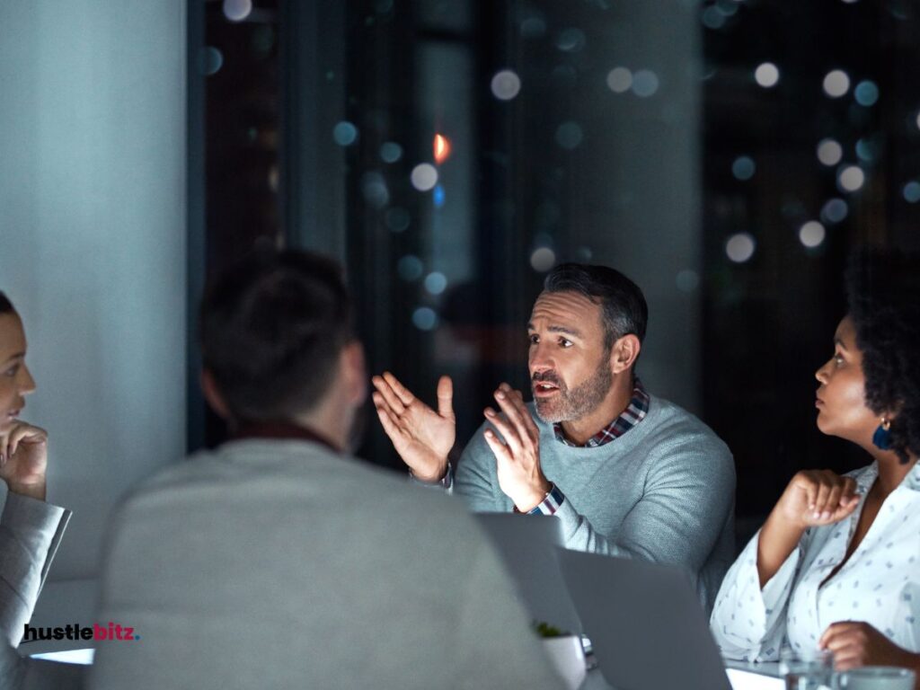 A group of people doing meeting and chatting inside the office