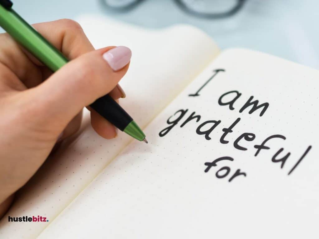 An image of a notebook with words "I am grateful for"