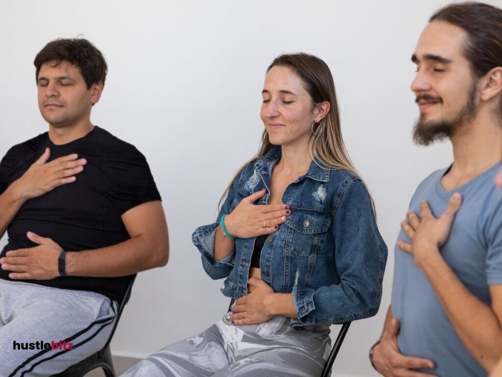 three people doing mindfulness exercise