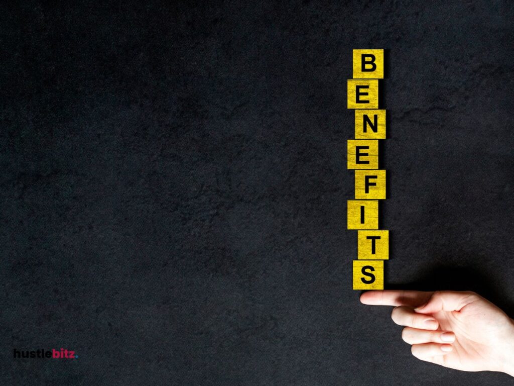 A hand holding a word "benefits"