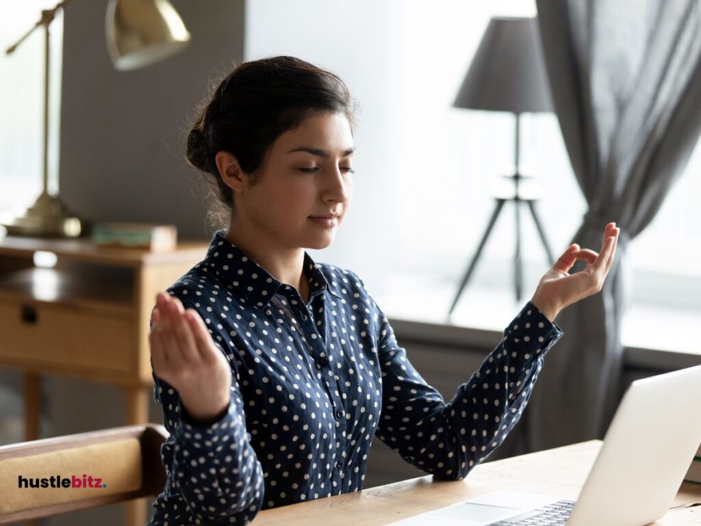 A woman doing meditation inside the office