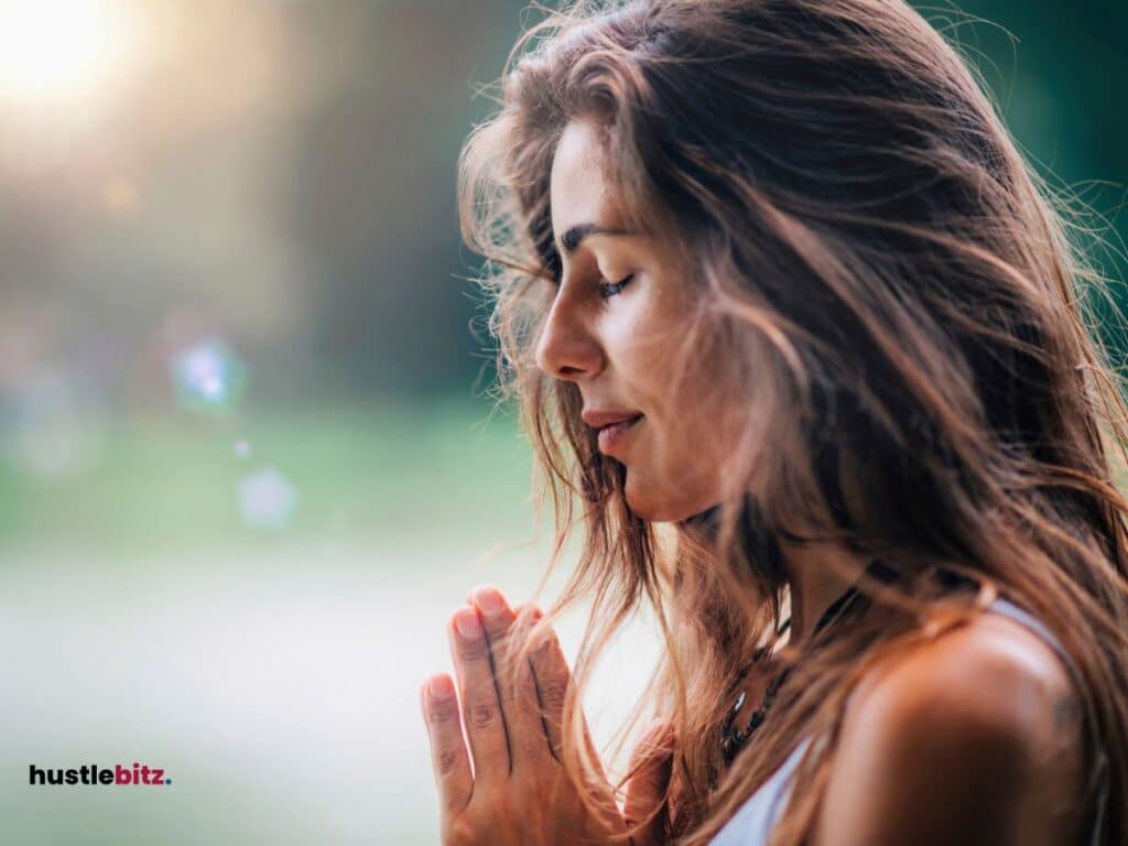 A woman with long hair doing meditation