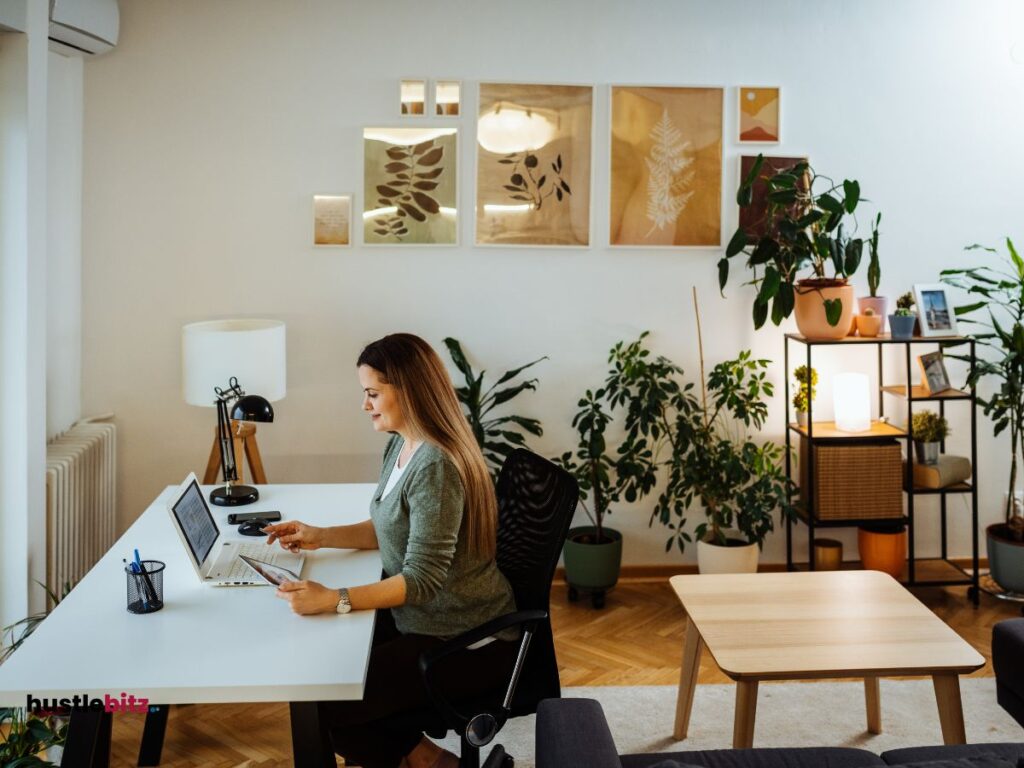 A woman sitting in the table using laptop