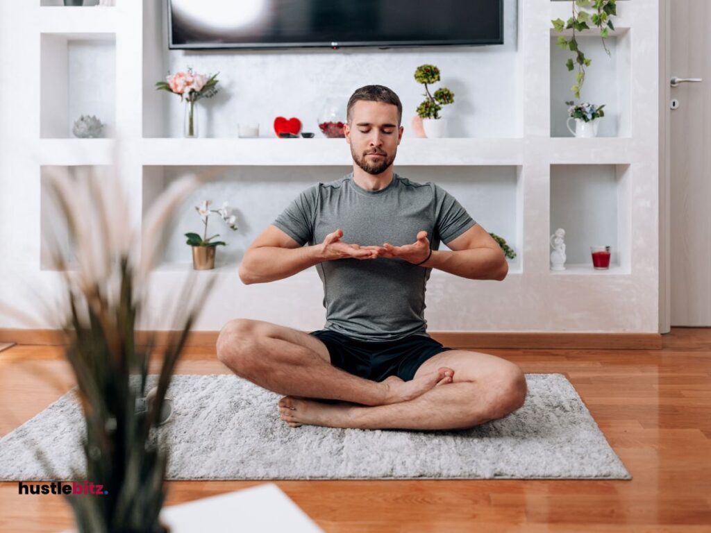 A man doing breathing exercise inside the house