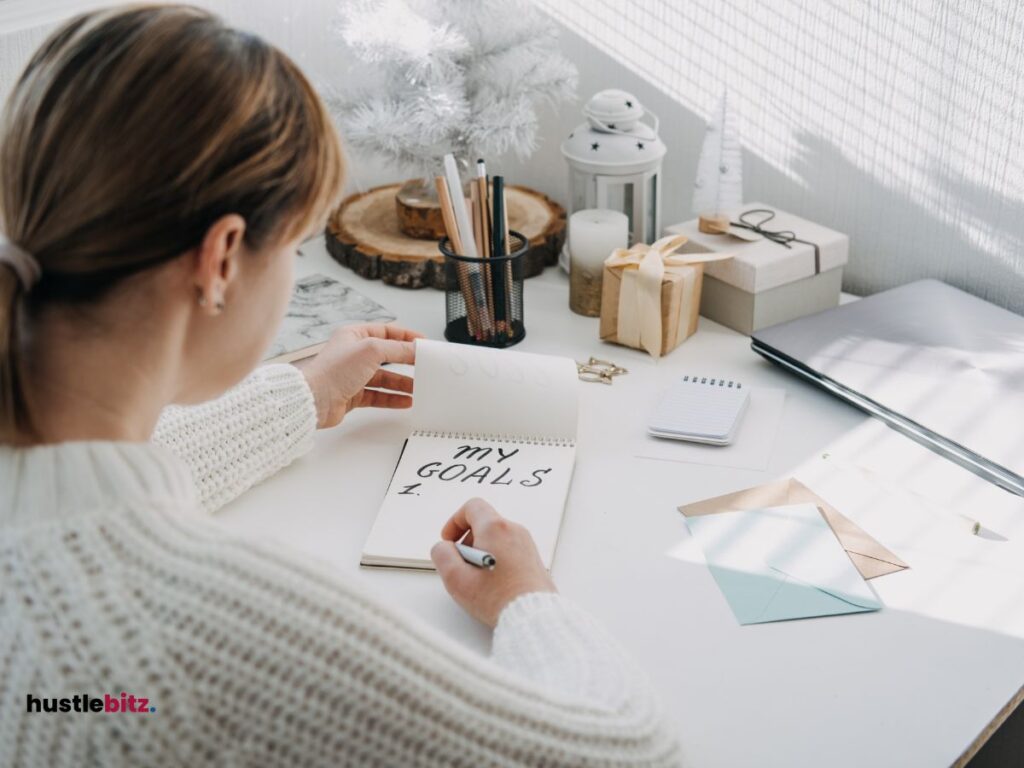 A woman doing writing at the table