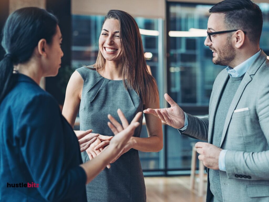 A picture of people smiling and talking to each other