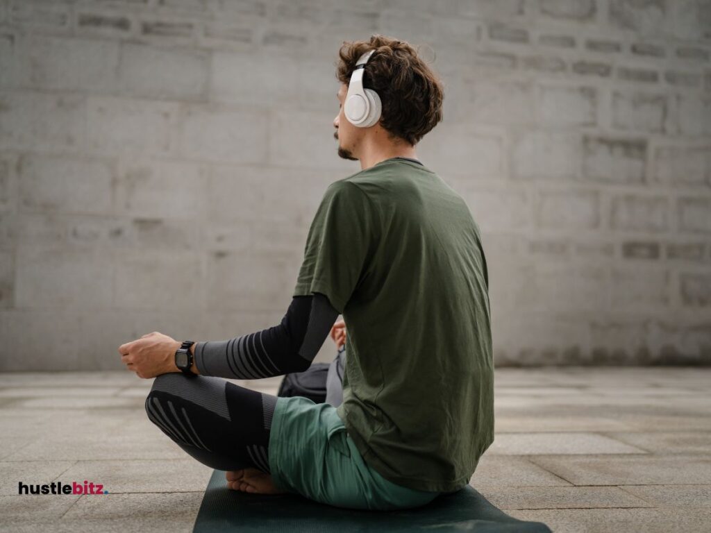 A man wearing headset preparing for meditation