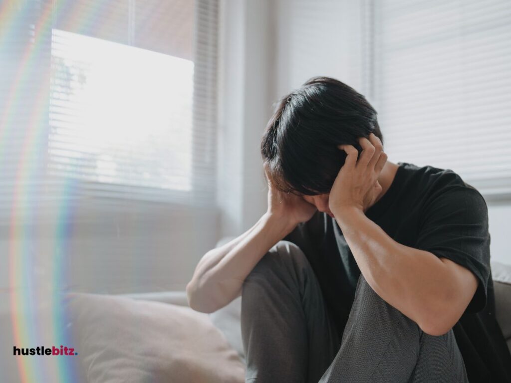 A man holding his head.