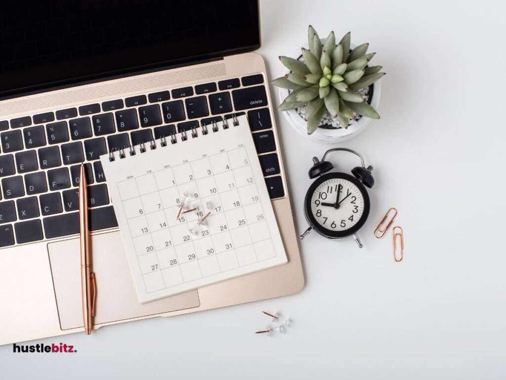 A clock, calendar and a laptop 