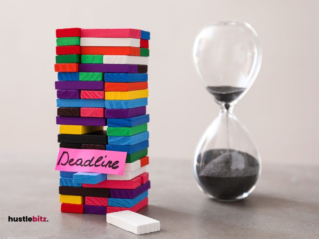 a hourglass and a jenga with a word deadline