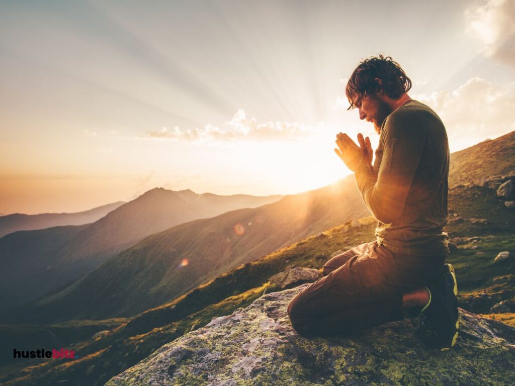 A man doing prayer with background of nature and sunlight