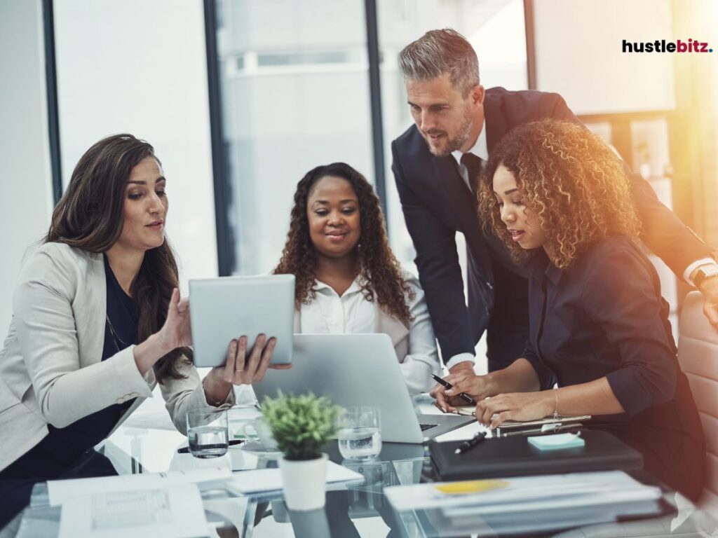 A group of people looking at the monitor