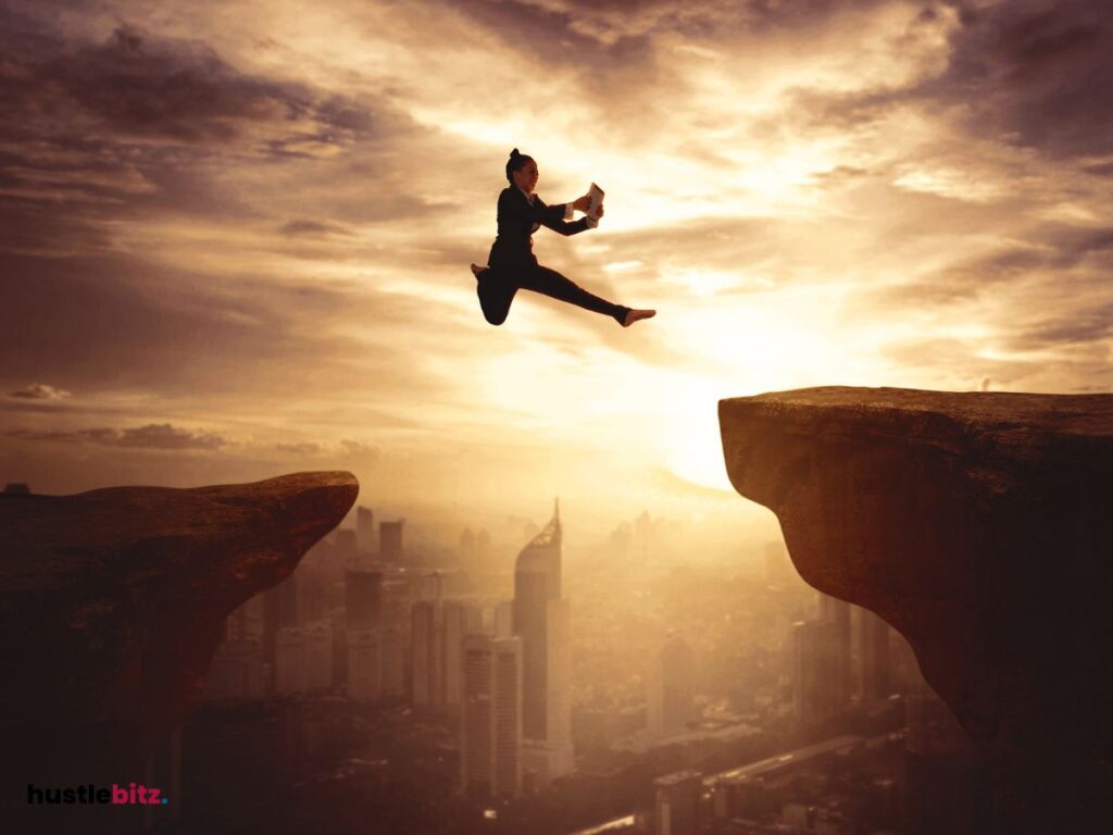 A woman jumping between two rocks