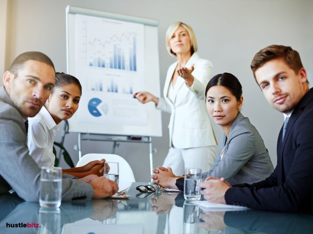 A group of people looking at you inside the office