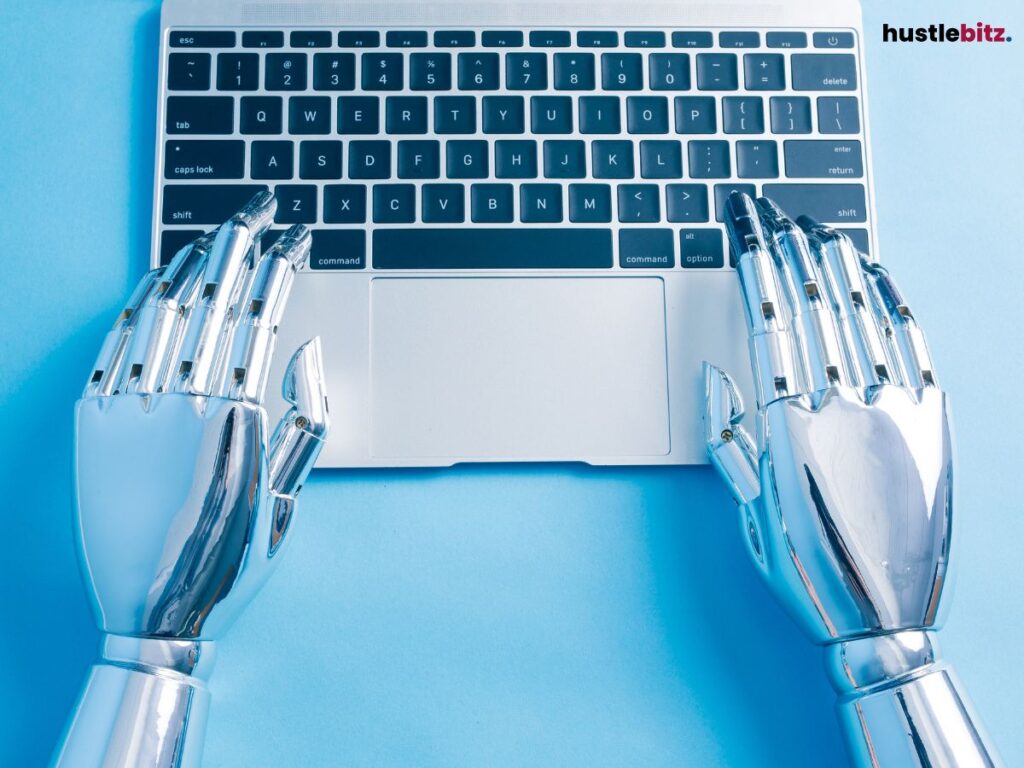 Robotic hands typing on a laptop keyboard.