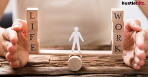 Hands balancing blocks labeled "Life" and "Work" on a seesaw.