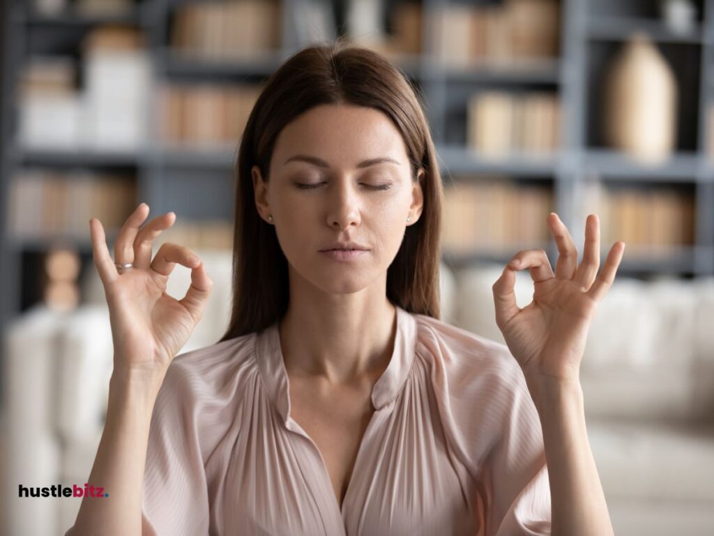 a woman doing meditation inside the office