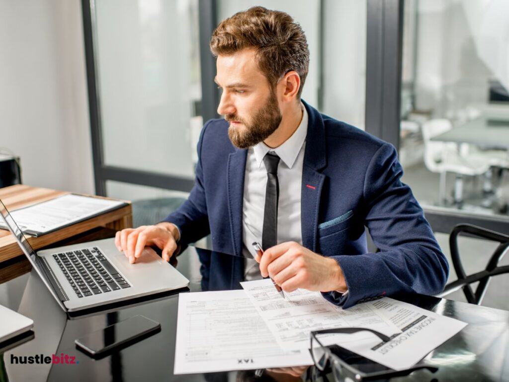 A man looking at the laptop screen 