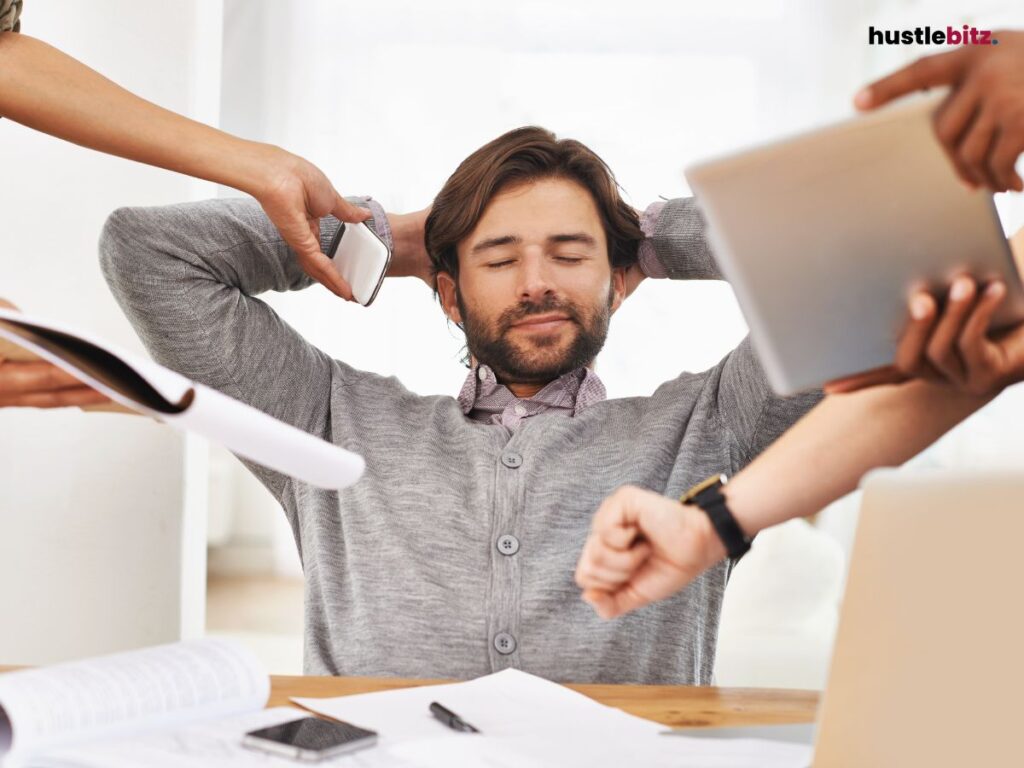 A man hold his head and smiles while taking a break
