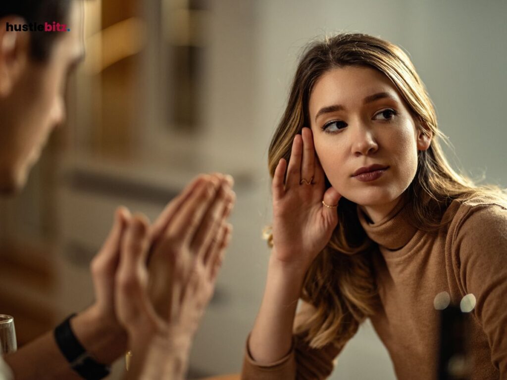 A woman listening intently, symbolizing focus and mental resilience.