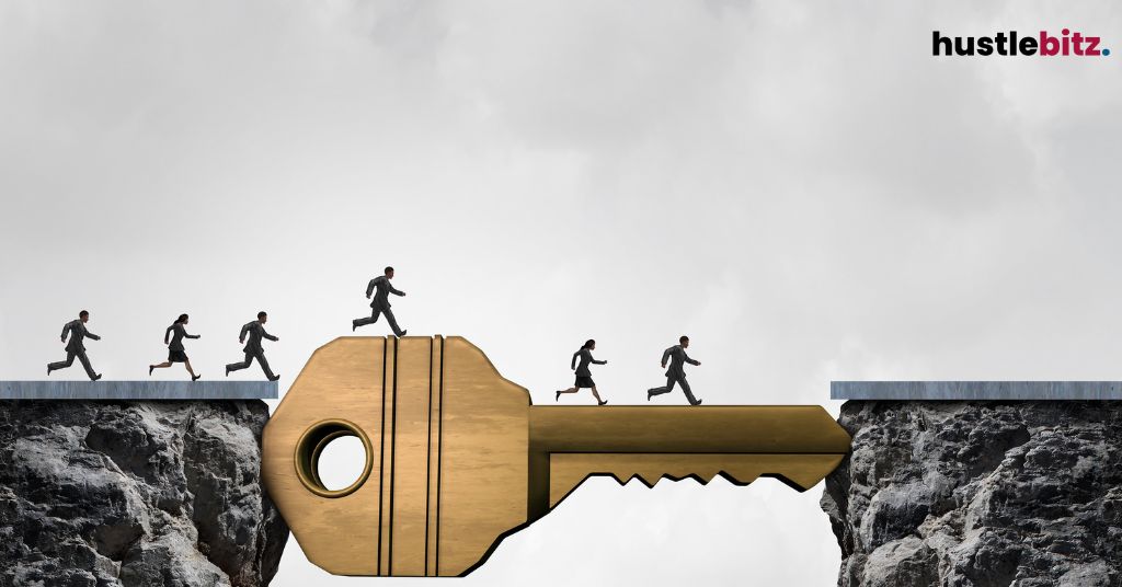 People crossing a gap on a large key-shaped bridge.