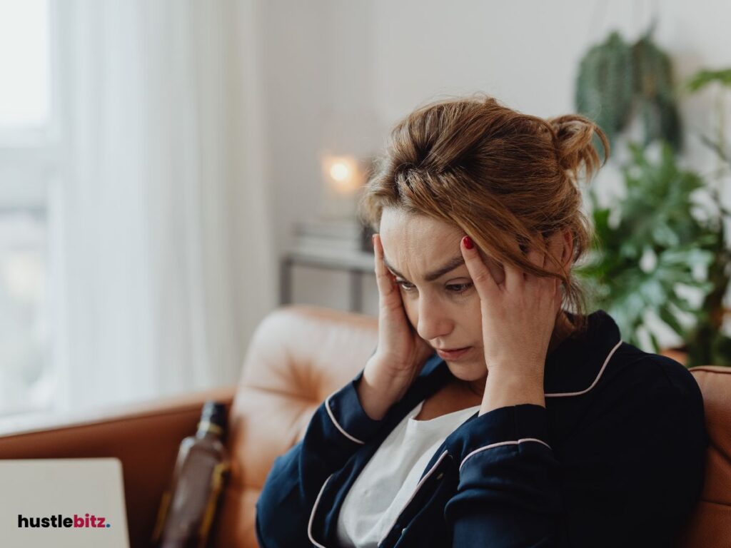 A woman hold her head with two hands