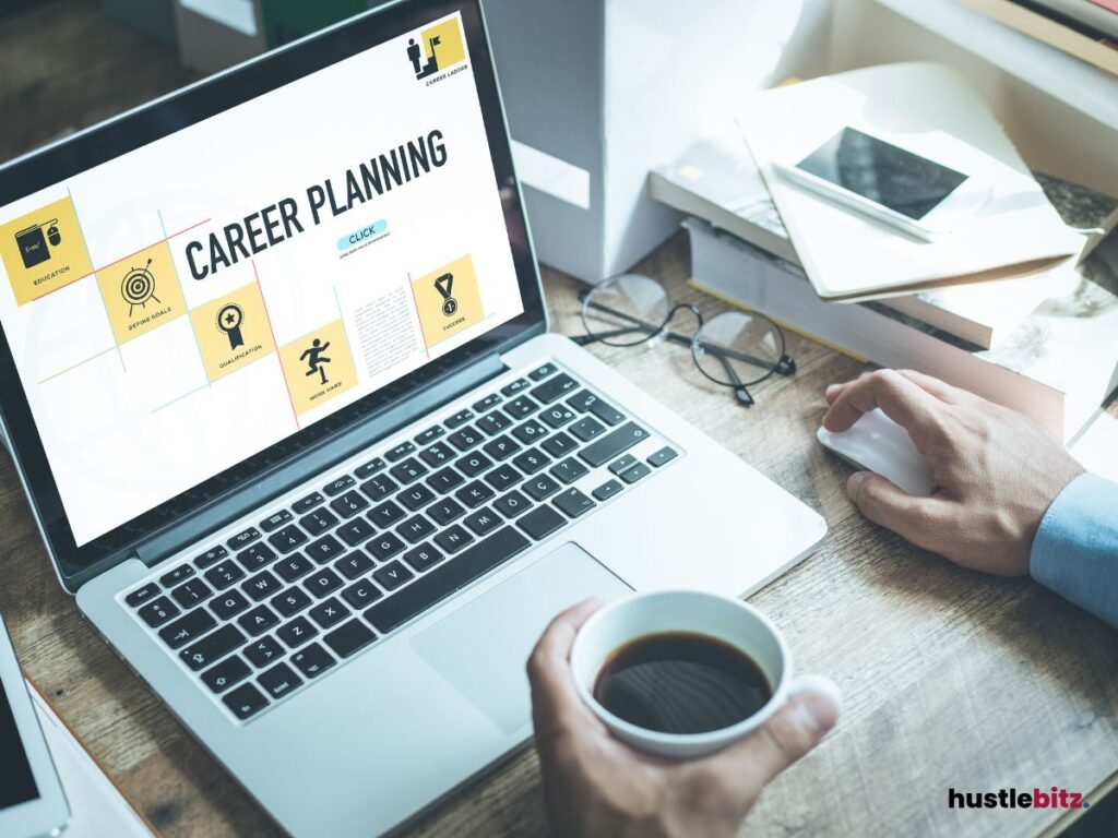 A laptop screen with the title "Career Planning" while holding a cup of coffee.