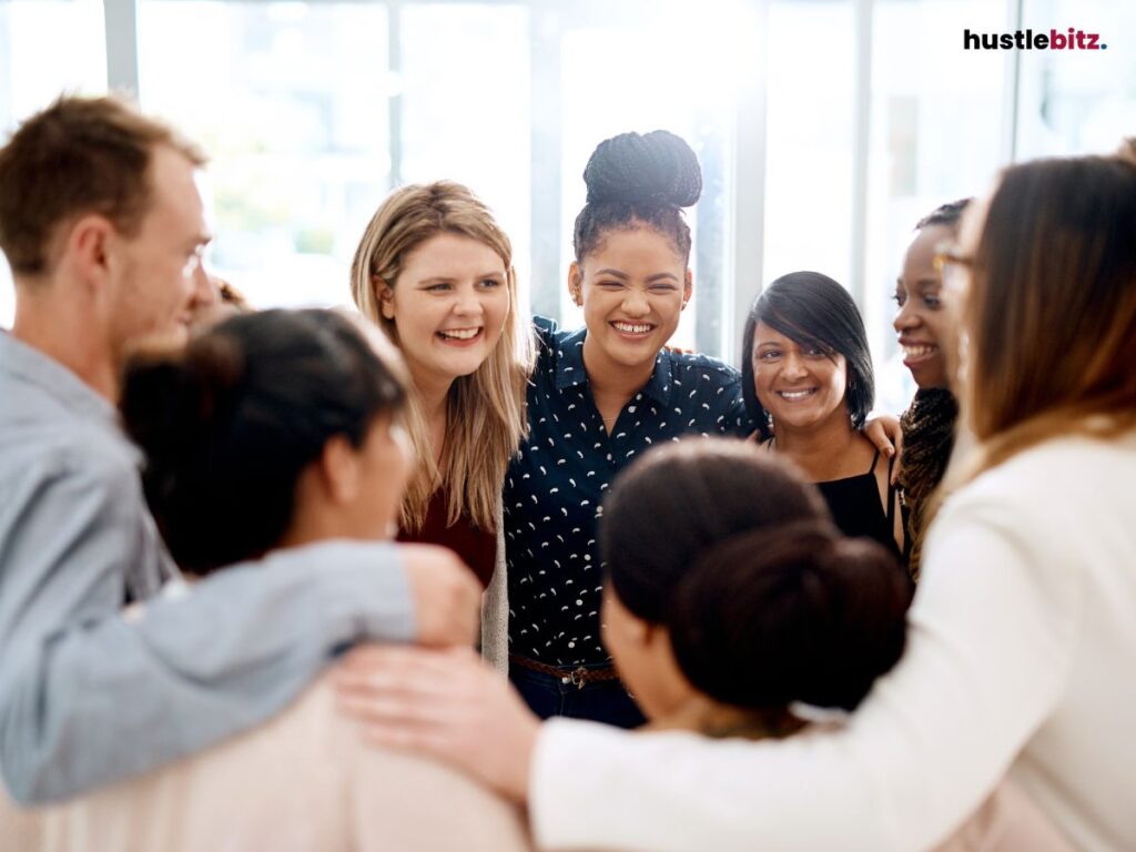 A group of people smiling inside the office