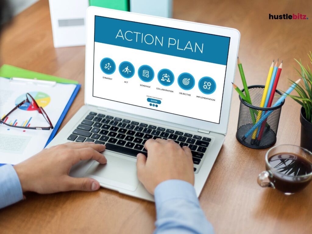 A hand tap the keyboard of the laptop with a word action plan