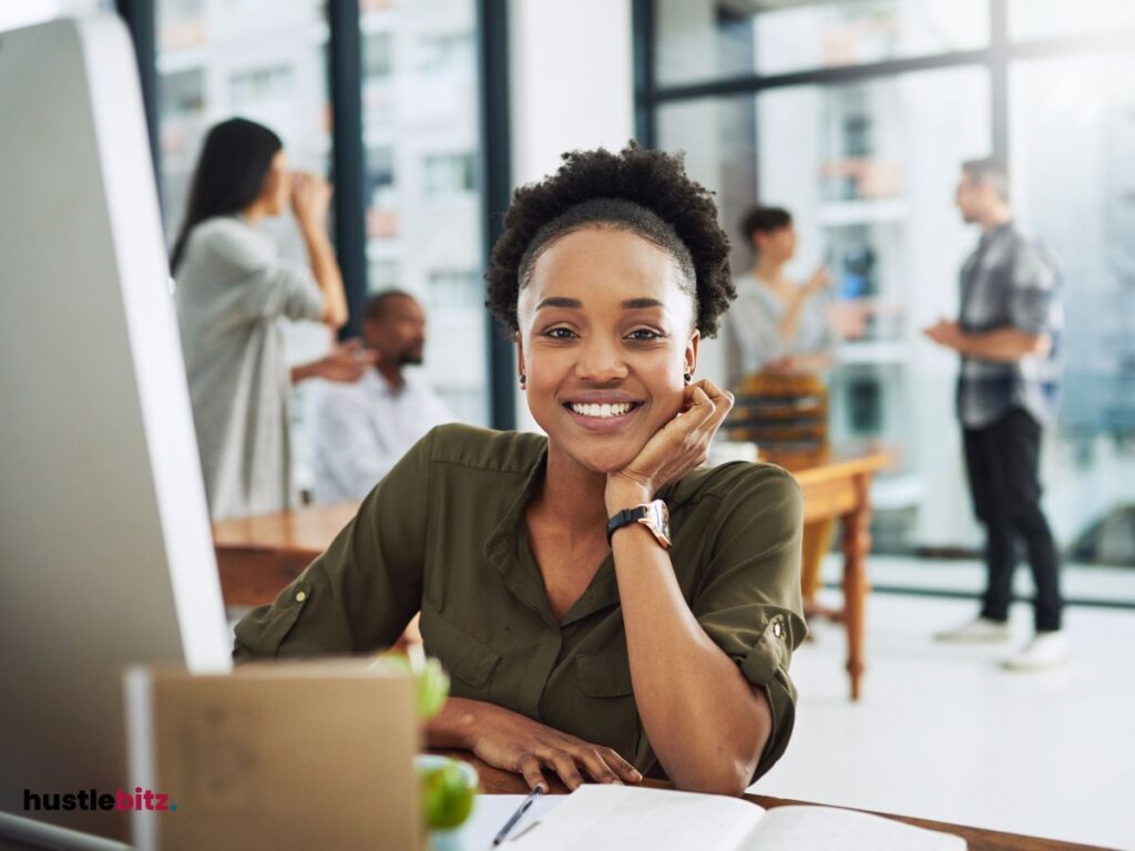 A woman smiles looking at the camera and people background