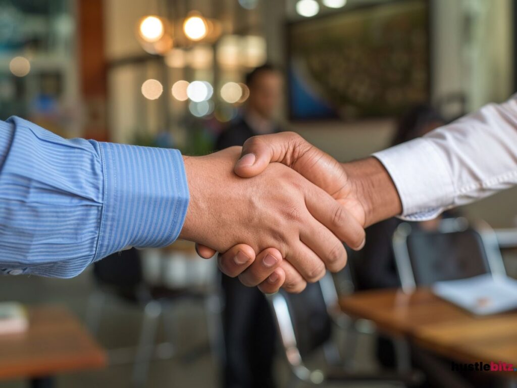 Close-up of a handshake between two business professionals.