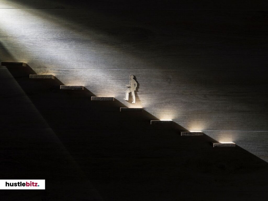 A figure walking up a glowing staircase in a dark setting.
