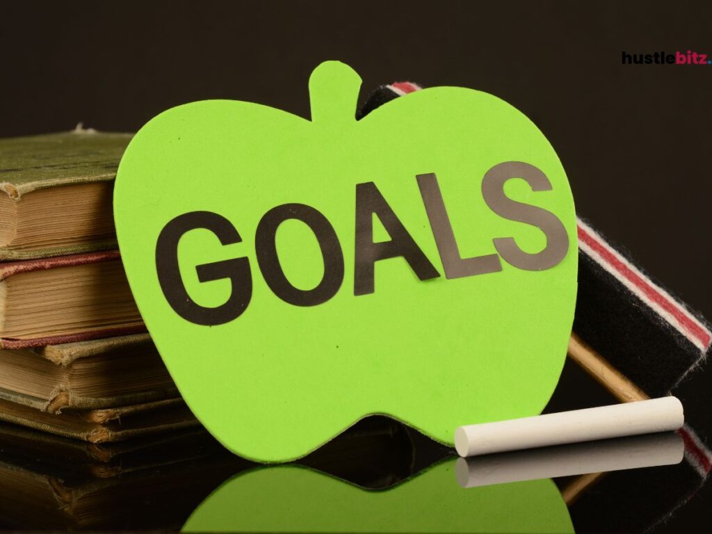 A green apple-shaped paper with the word "GOALS" on it.