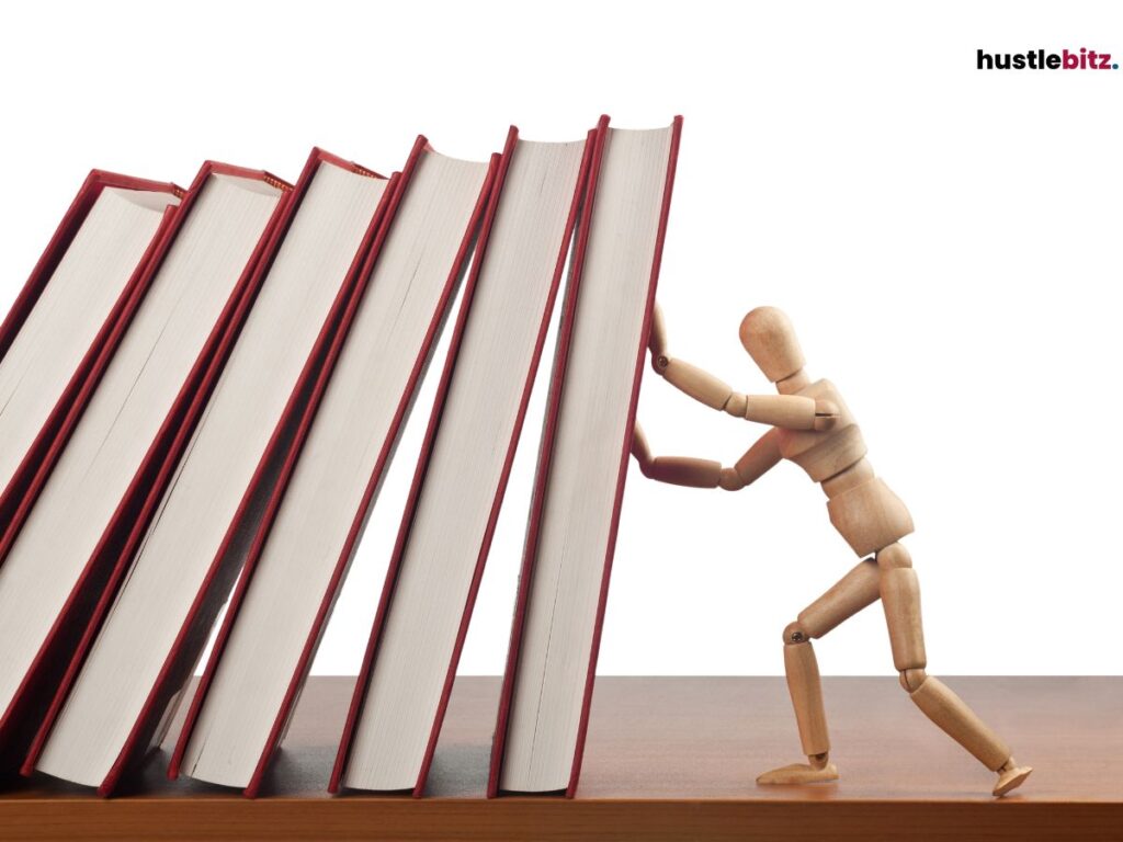 Wooden figure pushing against large red-bound books.