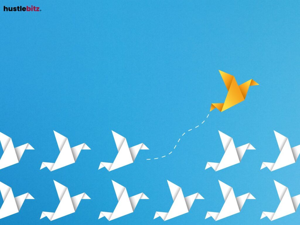 A yellow origami bird flies ahead changing path.