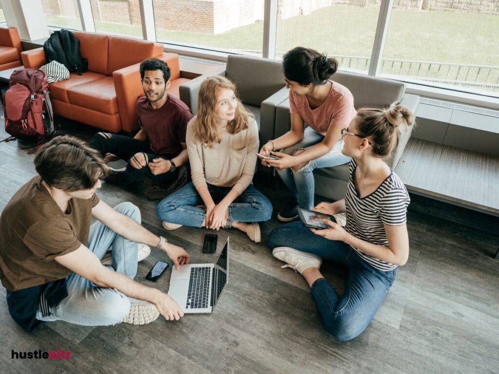 a group of people holding gadgets while talking