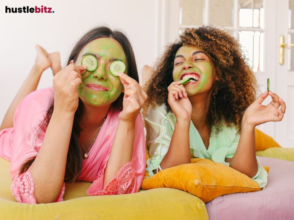 Two women doing facial holding the cucumber. 