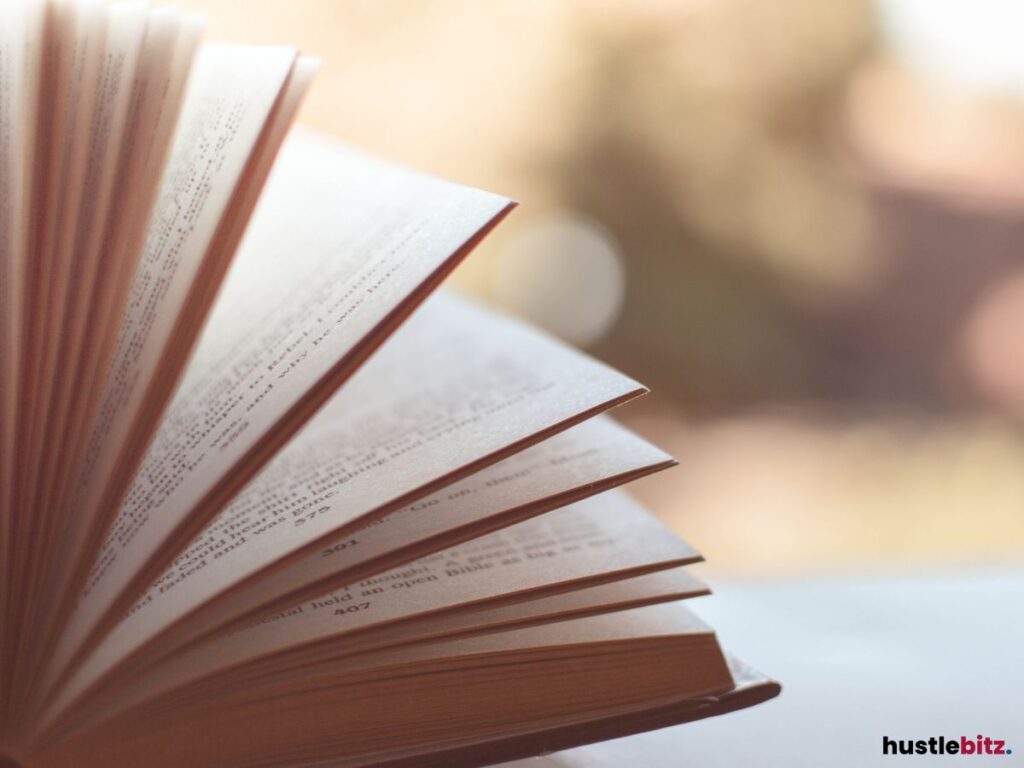 Close-up of an open book with pages turning.