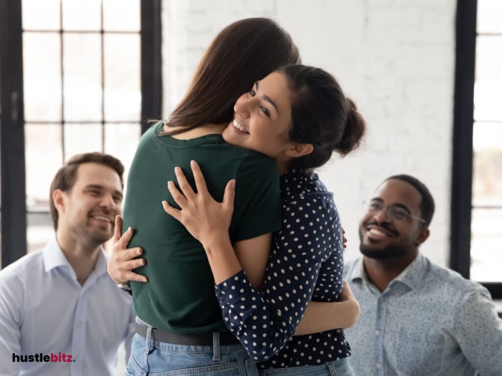 A group of people smiling, embracing reconciliation and fostering connection.